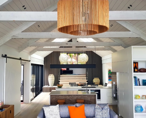 Exposed beams in bach on Waiheke Island by Whelan Building